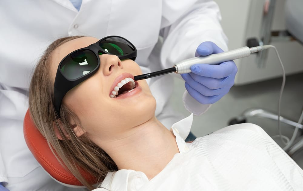 woman having a laser dental treatment