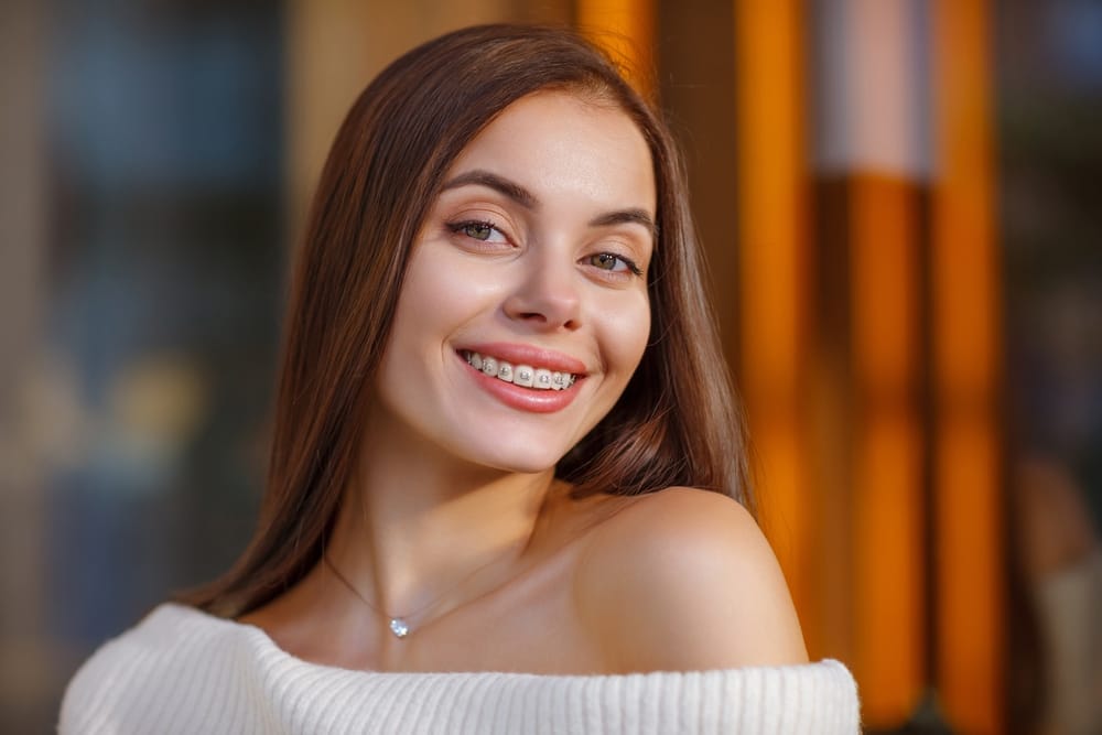 woman in braces posing for a photo - Gahanna Dentist