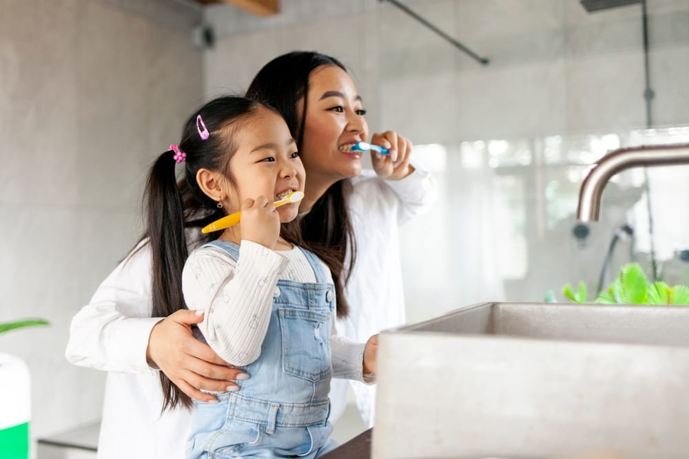 Mother and child brushing their teeth - Pediatric Dentist in Gahanna, Ohio