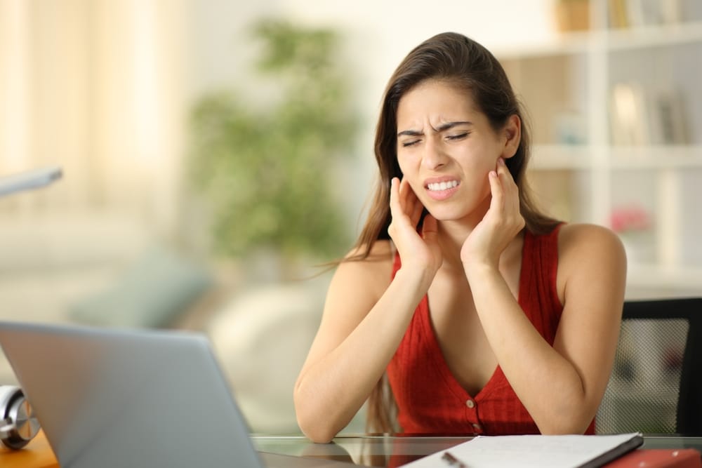 woman experiencing tooth pain - Wisdom Teeth Removal in Columbus, Ohio