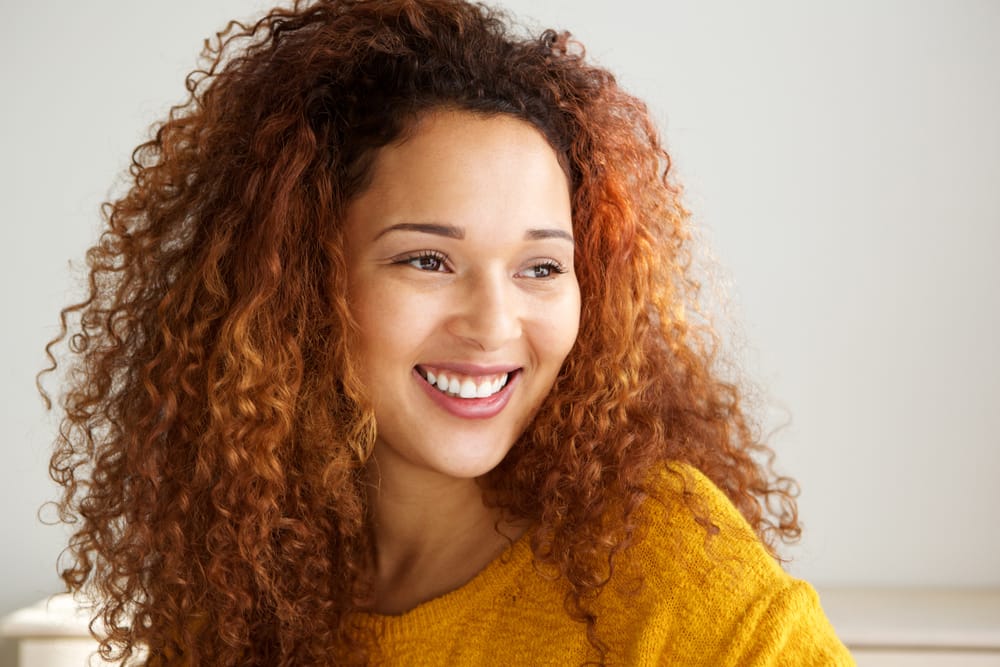 curly haired woman - Holistic Dentist Columbus Ohio